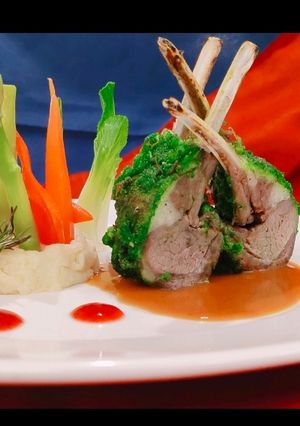 A picture of Herb Roasted Lamb Rack with Juslie, Ruby Reduction & Mash Potato.