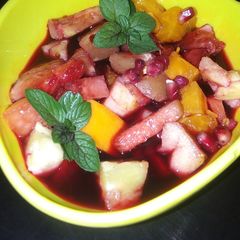 A picture of Fruit salad infused in sorrel (zobo) drink.