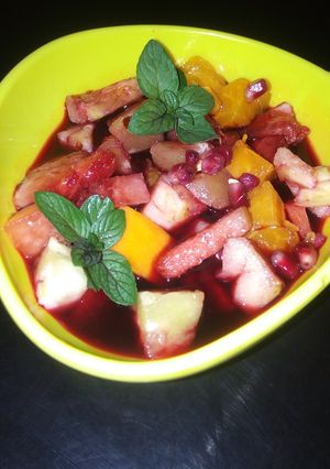 A picture of Fruit salad infused in sorrel (zobo) drink.