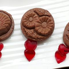 A picture of Chocolate budino with strawberry hearts.