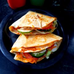 A picture of Tortilla Wrap with egg and veggies.