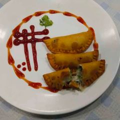 A picture of Cheesy Empanada.