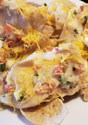 A picture of Homemade mouthwatering nachos.