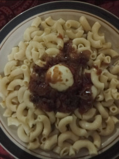 A picture of Macaroni &egg with sauce.