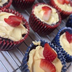 Chocolate Cupcakes with Vanilla Icing and Strawberries A picture of Chocolate Cupcakes with Vanilla Icing and Strawberries.