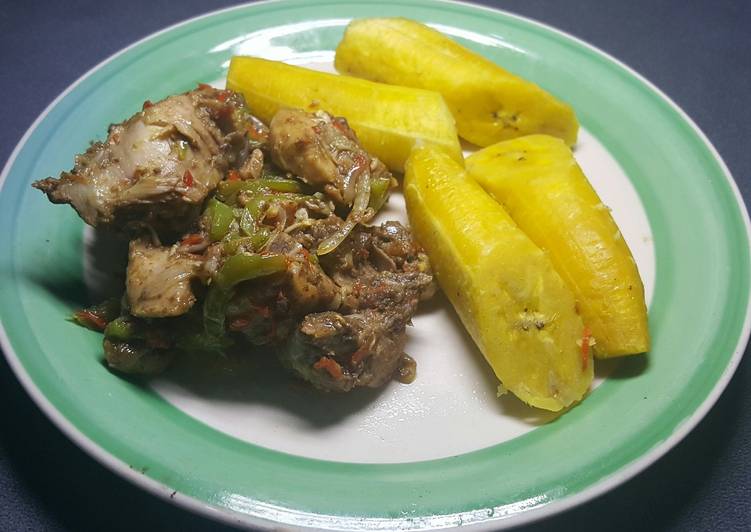 Chicken Asun  served with boiled plantain