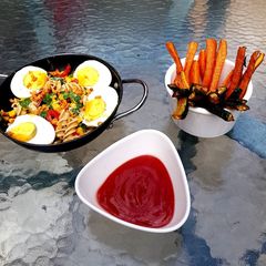 Veg Pasta with Egg and flavoured bacon bits carrot chips + Dip A picture of Veg Pasta with Egg and flavoured bacon bits carrot chips + Dip.