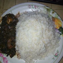 A picture of Vegetable soup with white rice.