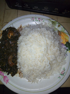 A picture of Vegetable soup with white rice.