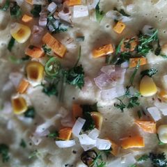 A picture of Open cheese corn and veg dosa!.