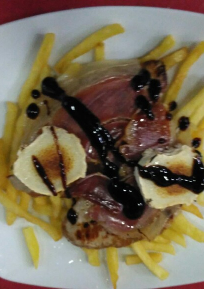 Una foto de Solomillo gratinado
