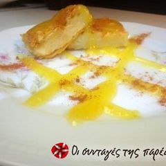 A picture of Milk pie with orange sauce from Ioannina.