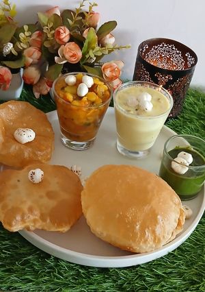 A picture of Varat special, poory bhaji, chattny, makhany ki kher.
