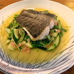 A picture of Ragout of sautéed turbot with Serrano ham, spring vegetable and pea shoots.