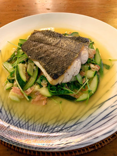 A picture of Ragout of sautéed turbot with Serrano ham, spring vegetable and pea shoots.