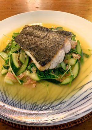 A picture of Ragout of sautéed turbot with Serrano ham, spring vegetable and pea shoots.