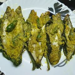 A picture of Steamed Pabda Fish in Bottle Gourd Leaf (Lau Patai Pabda Paturi).