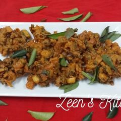 A picture of Two Onion Pakoras.