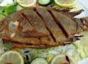 Una foto de  Mojarra al mojo de ajo