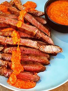 A picture of Grilled Wagyu Sirloin Tip Steak with Peri Peri Sauce.