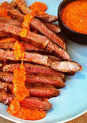 A picture of Grilled Wagyu Sirloin Tip Steak with Peri Peri Sauce.