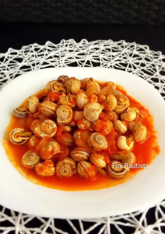 Una foto de Caracoles en salsa de tomate