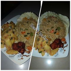 Jollof rice with potatoes and fried chicken A picture of Jollof rice with potatoes and fried chicken.