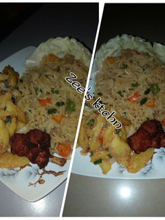 A picture of Jollof rice with potatoes and fried chicken.