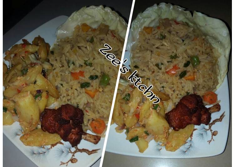 Jollof rice with potatoes and fried chicken