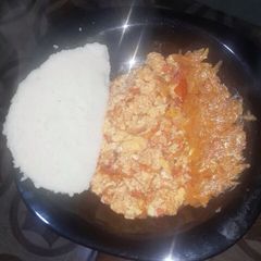 A picture of Vegetable salad with ugali and scrambled eggs.