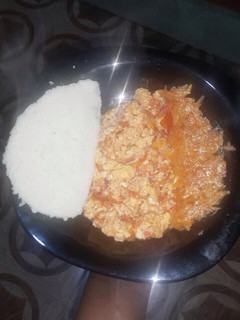 A picture of Vegetable salad with ugali and scrambled eggs.