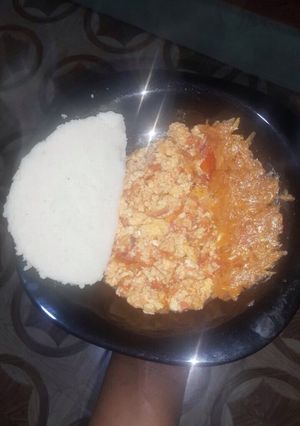 A picture of Vegetable salad with ugali and scrambled eggs.