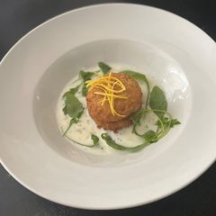 A picture of Parmesan Cod cakes with parsley sauce.