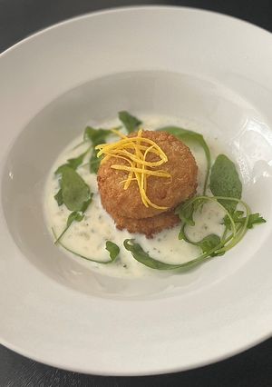 A picture of Parmesan Cod cakes with parsley sauce.
