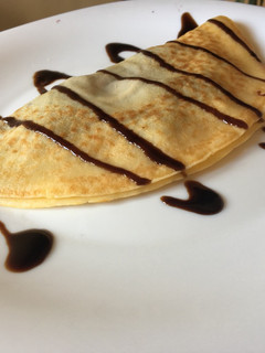 Una foto de Crepes de queso de cabra y mermelada de arándanos