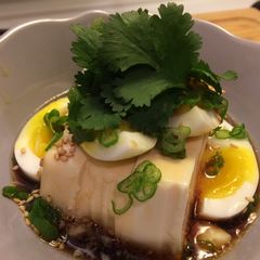 A picture of Silky tofu and half boiled egg with special sauce.