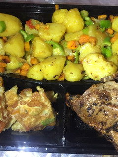 A picture of Stir fry potatoes,egg rolls&grilled chicken.