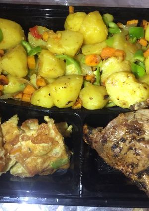 A picture of Stir fry potatoes,egg rolls&grilled chicken.