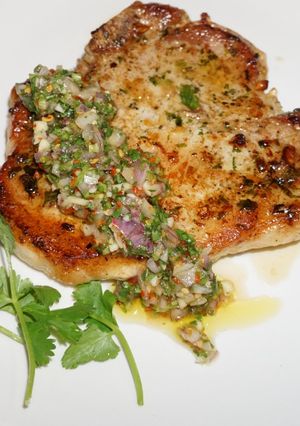 A picture of Pork Chops with Cilantro Sauce.