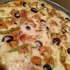 A picture of Chicken tikka pizza.