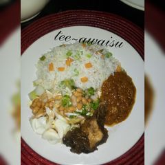 A picture of White rice,stew and salad.