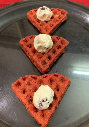 A picture of Whole wheat beetroot waffles with frozen berries yoghurt.
