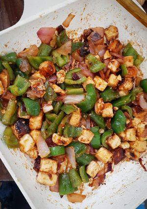 A picture of Stir fried Paneer with peppers.