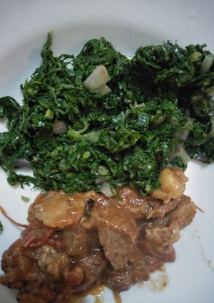 A picture of Sukuma wiki with beef.