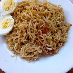 A picture of Indomie and boiled eggs for lunch.