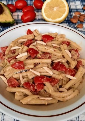 A picture of Cold Pasta with Avocado Pesto and Grape Tomatoes.
