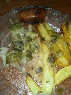 Una foto de Bife de jamón con papas al horno al verdeo