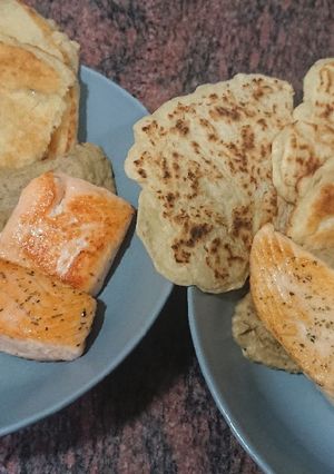 A picture of Salmon with Fine Herbs on Baba Ganoush with Naan Bread.