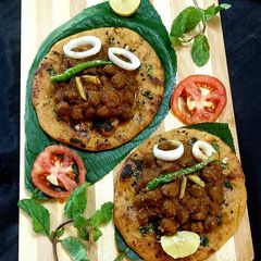 A picture of Black Chole With Wheat flour Kulcha.