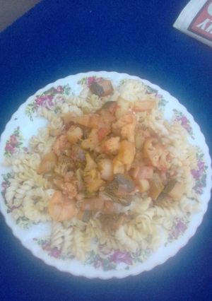 A picture of Twisted macaroni with baby marrow.